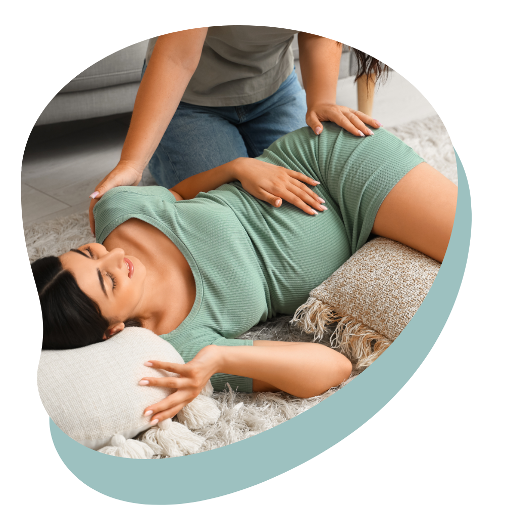 A doula teaching a pregnant mother the Miles Circuit