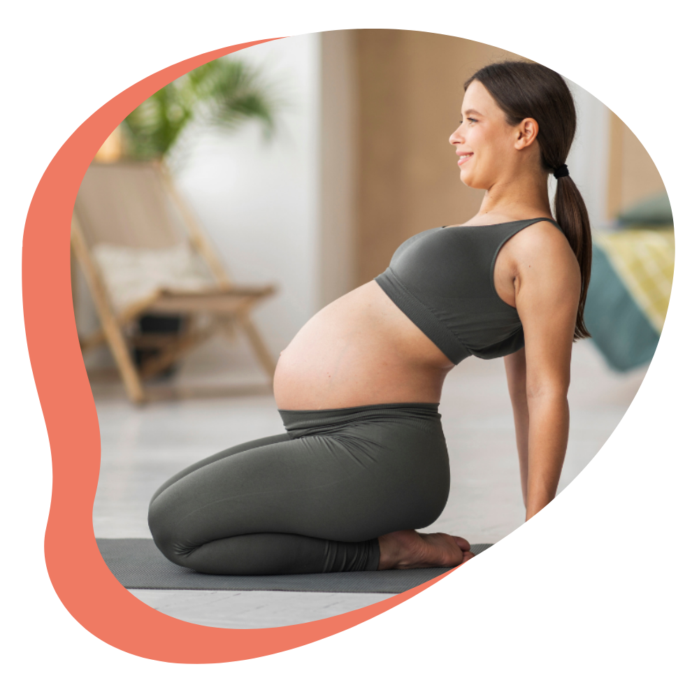 pregnant person in prenatal yoga class