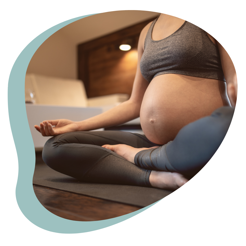 pregnant woman doing prenatal yoga